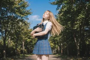 Blonde Girl Walking Down a Tree-Lined Street Video Prompt
